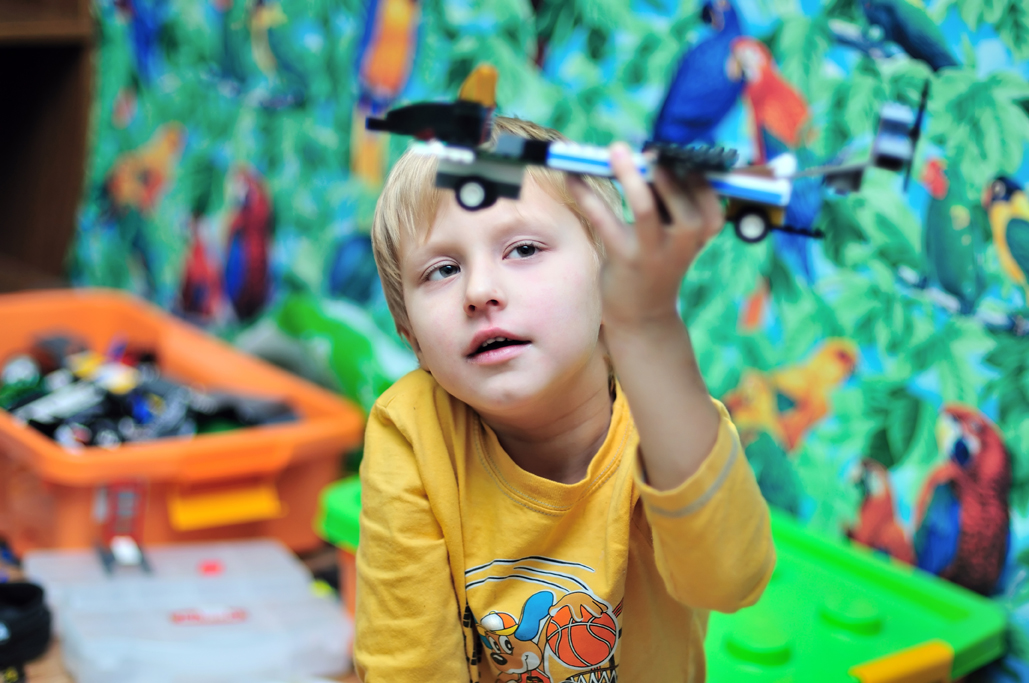 Boy with spaceship and lego